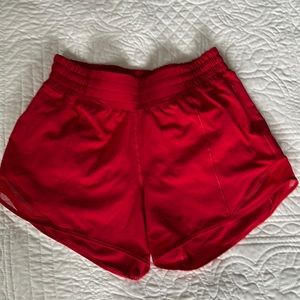 Size 4 tall NEVER WORN! Perfect condition! Lululemon Hottie Hot high rise shorts